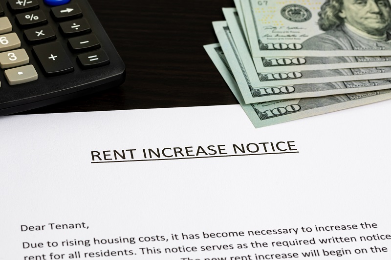 Rent increase notice sitting on desk