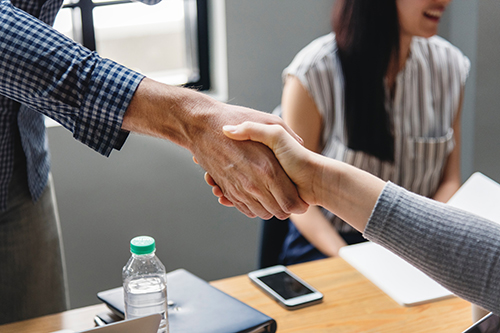 Two people shaking hands